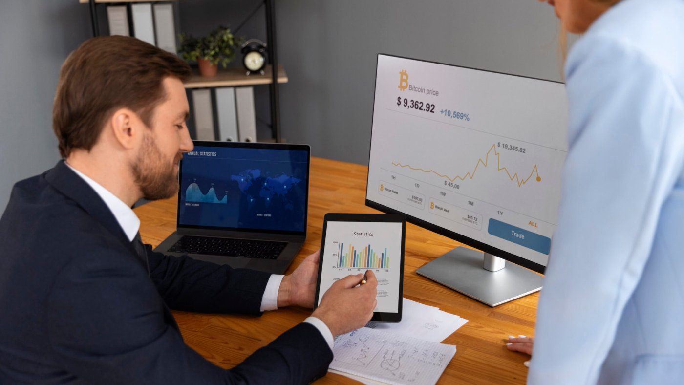person-looking-finance-graphs
